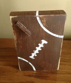 a wooden box with a football painted on it