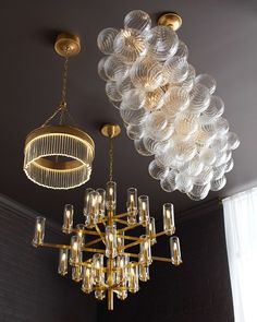 a chandelier hanging from the ceiling in a room