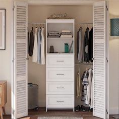 an open closet with white shutters and drawers