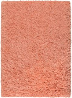 an orange shaggy rug on a white background