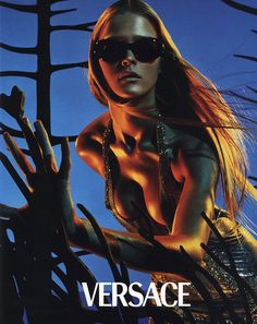 the poster for versa shows a woman in sunglasses and gold dress with trees behind her