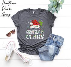 Grandma Christmas Shirt, Grandma Claus Tee, Gift for Mom, Christmas Party, Cute Christmas Gift For Nana, Grandma Christmas Shirt, Xmas Shirt We use premium t-shirts, hoodies which have a soft and light feel, It's very comfy and with it's unisex sizing it's perfect for both men and women. 👉How Do I Order👈 1️⃣Please, Check and Review all Photos. 2️⃣ Select Your T-Shirt Size and T-Shirt Color from drop down menus. 3️⃣ Choose Your Quantity as much as you want. 4️⃣ Click ADD TO CART. And, you can g Nana Christmas Gifts, Grandma Christmas, Nana Grandma, Grandmas Christmas, Gift For Mom Christmas, Santa Shirts, Cute Christmas Gifts, Grandma Shirts, Nana Gifts