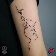 a woman's face is drawn on the arm