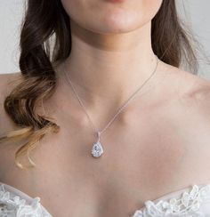 This wedding necklace is handmade with the finest Cubic Zirconia stones and Rhodium plated. Perfect accessory for your wedding or every special moment in your life! These  necklace is stunning in person! The pendant drop length from the chain to the bottom of the drop is 1.3" (3 cm). Chain is Rhodium plated and measure approximately 16" (40 cm) in length. The extender of the chain is 2" (5 cm) long.***All my designs are shipped from France. Please make sure you have enough time to get your purch Pear-shaped Jewelry With Diamond Accents For Wedding, Pear-shaped Diamond White Wedding Jewelry, Silver Bridal Necklace With Pearl Drop And Cubic Zirconia, Wedding Necklaces With Sparkling Cubic Zirconia, Elegant Teardrop Pendant Necklace In Cubic Zirconia, Cubic Zirconia Bridal Pendant Necklace, Brilliant Cut Diamond White Drop Necklace For Wedding, Pear-shaped Silver Cubic Zirconia Wedding Ring, Pear-shaped Diamond Cut Jewelry For Wedding