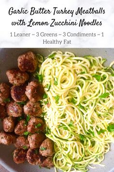 spaghetti and meatballs with lemon zucchini noodles in a white bowl on a marble table