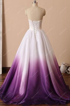 a white and purple wedding dress on a mannequin