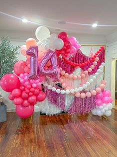 balloons and streamers decorate the entrance to a party