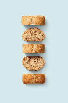 three pieces of bread are arranged in the shape of four slices on a blue background