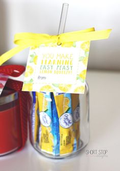 a jar filled with lemonade next to a cup full of juice and a sign that says you make learning easy