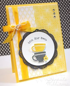 a card with a yellow ribbon around it and a coffee cup on the front that says tea for two