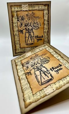 two handmade greeting cards with flowers in vases and thank you written on them