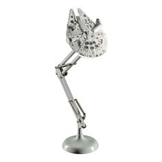 a silver desk lamp with a star wars character on it's arm and head