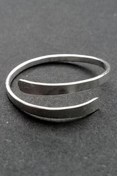 This hand hammered ring is small and meant to be worn as a Midi Ring or Toe Ring. US Ring size 3, adjustable from sizes 3-4 FOR FULL SIZE RING (Sizes 5-12) -> https://www.etsy.com/listing/899750825/sterling-silver-ring-hammered-silver Comfortable, Durable, and Slim 16 gauge Sterling Silver Adjustable, US Sizes 3-4 This adjustable Toe/Knuckle/Midi Ring is fully handmade and marked with a 925 which means 100% Solid .925 Sterling Silver Choose your style! You can wear this cute petite ring as a Coil Ring, Silver Leaf Ring, Petite Ring, Hammered Band, Hammered Rings, Choose Your Style, Midi Ring, Ring Hand, Hammered Metal