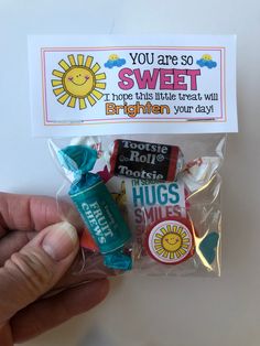 someone is holding some candy in their hand and there is a card with the message you are so sweet to hope this little treat will brighten your day