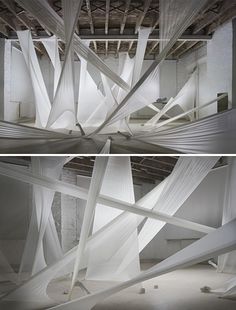 two photographs of white fabric hanging from the ceiling in an empty room with no people