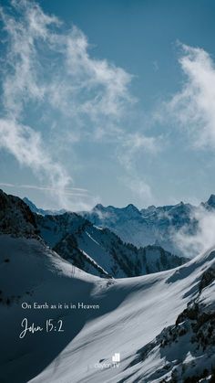 the sky is blue and there are mountains in the background with snow on them,