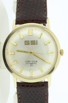 This spectacular piece was made back in the 1950 by Lord Elgin and is a automatic 25 jewel Swiss movement. The case is 14K yellow gold and waterproof. The case of the watch measures 36.3mm wide, 38.6mm long, sits 10.3mm tall, and the gap between the lugs is 18mm wide.  Great for the Doctor in the family or the lawyer just starting out.  B436GYPPK--Please reference our policy for more details--***For International orders, please provide a phone number for shipping purposes. Just place a note in t Omega Seamaster Automatic, Lapis Ring, The Doctor, The Gap, Lawyer, Gold Watch, Phone Numbers, Phone Number, Wrist Watch