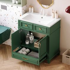 a bathroom vanity with green drawers and white sink in the corner next to a mirror