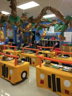 a classroom decorated with yellow school buses and decorations