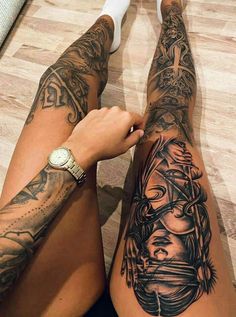 a person with tattoos on their legs