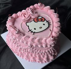 a hello kitty birthday cake with pink icing