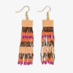 Embrace the vibrant spirit of Jaipur with the Billie Mixed Horizontal Stripes Fringe Earrings! Featuring Peach, Bronze, Coral, and Magenta hues, these earrings are a playful addition to your jewelry collection. The intricate design with tiny glass beads offers a delicate and feminine look that's perfect for any occasion. --DETAILS-- 3.3" L, .62" W Handmade by skilled artisans in India Hypoallergenic nickel + lead-free brass hardware These accessories are made by human hands. A slight variation in size and color is considered part of the beauty of these one-of-a-kind pieces. To extend the life of your accessories, store them in a dry place while swimming, showering, or working out. Original design copyright INK+ALLOY© --END OF DETAILS-- Orange Beaded Drop Earrings, Orange Tiny Beads Drop Earrings, Orange Drop Earrings With Tiny Beads, Artisan Orange Beaded Earrings, Orange Tiny Beads Earrings For Festival, Orange Tiny Beaded Earrings For Festival, Artisan Beaded Earrings For Festive Occasions, Orange Bohemian Earrings With Tiny Beads, Orange Dangling Beads Earrings For Festival