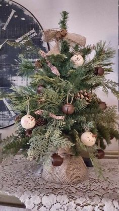 a christmas tree decorated with ornaments and pine cones