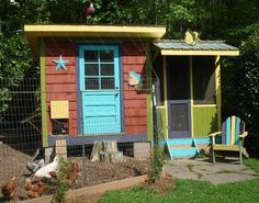 a small colorful building with a blue door and window