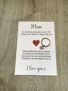 a card with a heart shaped keychain attached to it