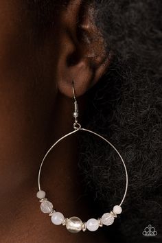 Infused with dainty silver accents, opaque and glassy white beads glide along a wire hoop for an ethereal pop of color. Earring attaches to a standard fishhook fitting.

 Sold as one pair of earrings. Mixed Metal Jewelry, Pink Bubbles, Paparazzi Accessories, Paparazzi Jewelry, White Earrings, Silver Accents, White Beads, Boutique Jewelry, Bling Jewelry