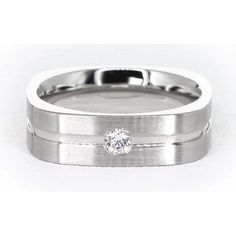 a wedding band with a diamond in the center