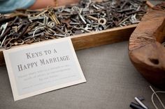 keys to a happy marriage on display in a wooden box with a sign that says keys to a happy marriage