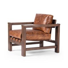 a brown leather chair sitting on top of a wooden frame