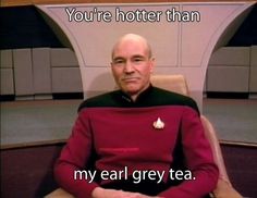 a man sitting in a chair with the caption you're hotter than my ear grey tea