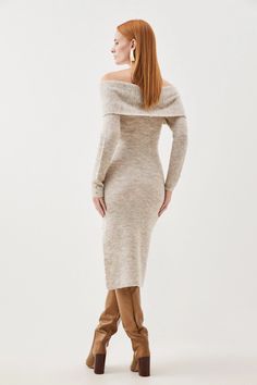 Effortless elegance exudes with this dress, crafted from a soft wool knit blend that drapes the silhouette in a fitted form from a roll neck to a midi length. Finished with a bardot neckline for sultry appeal, pair this piece with knee high boots for a cooler season dress outfit that promises to exude luxury.Wool knit blendRoll neckLong sleevesBardot neckline Winter Knee-length Knit Midi Dress, Chic Knitted Knee-length Midi Dress, Knee-length Cable Knit Winter Dress, Beige Knee-length Sweater Dress, Beige Knitted Knee-length Sweater Dress, Off The Shoulder Knit, Bardot Neckline, Wool Knit, Knit Midi