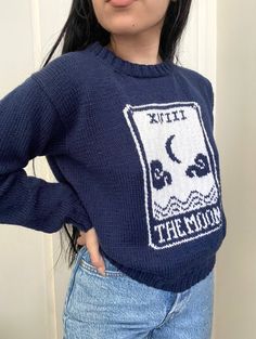 a woman wearing a blue sweater with the words, hit it in the middle