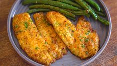 some chicken and green beans on a plate