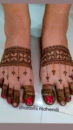 the feet are decorated with henna and jewels