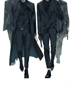 two men in black suits walking down the runway