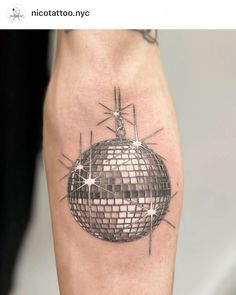 a tattoo with a disco ball on it