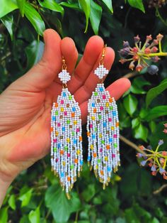 Design Drop Fringe Beaded Earrings with Colorful Confetti Dots.
They are elegant, fashionable and versatile, suitable for everyday wear, and for the holiday.
Developed a unique and inimitable design.
Made of high quality Japanese and Czech beads. (colors may vary due to your monitor settings).

Length - 10.5 centimeters
Width - 2.5 centimeters White Beaded Earrings With Faceted Round Beads, White Round Beaded Earrings With Faceted Beads, White Faceted Beaded Round Earrings, White Faceted Beads Beaded Earrings Gift, White Dangle Earrings With Faceted Beads, White Faceted Beaded Earrings As A Gift, White Beaded Earrings For Beach, White Beaded Earrings With Round Tiny Beads, Adjustable White Beaded Earrings With Faceted Beads