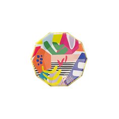 a multicolored paper plate sitting on top of a white surface with an abstract design