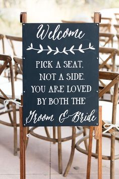 a sign that reads welcome pick a seat not a side you are loved by both the groom and bride