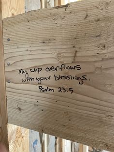 a piece of wood that has some writing on it