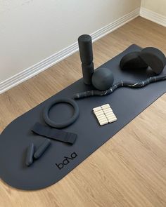 a yoga mat with various items on it