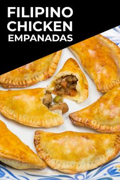 a white plate topped with empanadas covered in meat