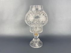 a clear glass vase sitting on top of a table