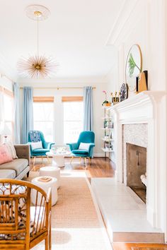 a living room filled with furniture and a fire place