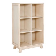 a white bookcase with four shelves on one side and two doors on the other