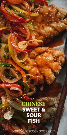 chinese sweet and sour fish with vegetables on the side